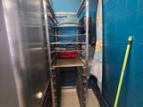 an image of a kitchen with a rack of food