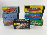 four boxed boxes of toy cars are stacked on top of each other