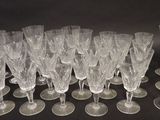 a lot of wine glasses sitting on a table