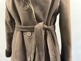 an image of a woman ' s coat with a fur collar