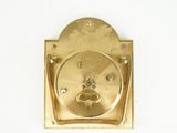 a gold plate with a dog ' s paw on it