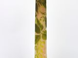 a vase that has a green and pink design on it