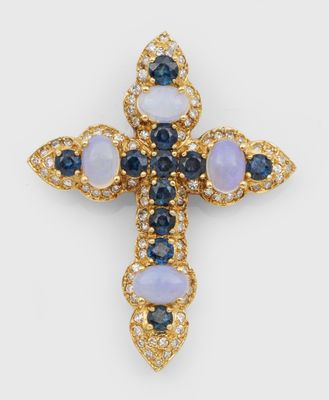 un pendentif en forme de croix en or 18 carats orné de pierres bleues et blanches