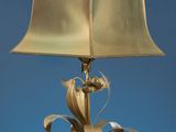 a gold lamp with a gold shade on it