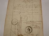 a piece of paper with stamps on it on a table