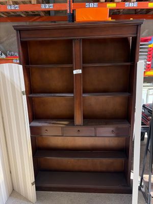 an image of a wooden bookcase in a store