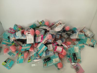 a pile of toothbrushes and toothpaste on a table