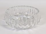 a clear glass bowl on a white surface