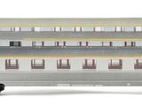 a silver train car that is sitting on a white surface