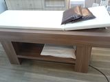 a table that has a pillow on top of it