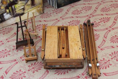 a small wooden table with chairs and a chair on the floor
