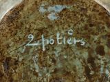 a close up of a plate with the words 2hoties written on it