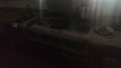 a stove with a pot on top of it in a kitchen
