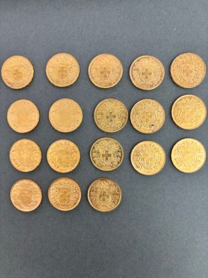 some gold coins are arranged in a square pattern on a gray surface