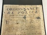 an old newspaper on display on a table