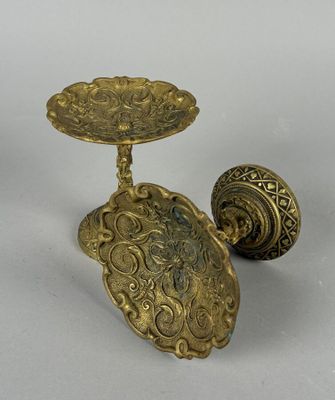 pair of antique brass candlesticks with ornate design