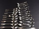 a lot of spoons and spoon spoons on the table