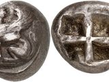 a silver coin with a cross and a man on it
