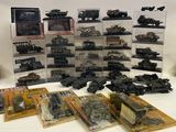 a lot of toy military vehicles on display on a table