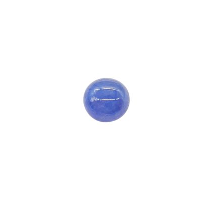 a close up of a blue glass ball on a white surface