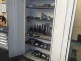 many tools on the shelves in the garage