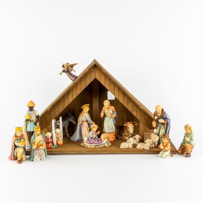 figurines of a nativity scene with a manger and a baby jesus