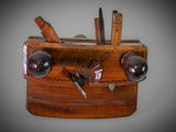 a wooden box with a bunch of tools inside of it