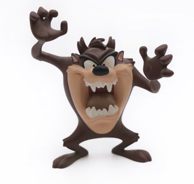 a figurine of a cartoon character on a white background