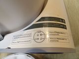 a close up of a white blender on a wooden table