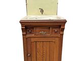 a wooden cabinet with a sink on top of it