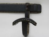 a close up of a black leather belt with white stitching on it