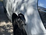 a white car parked on the side of the road