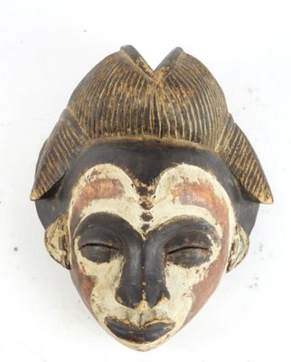 an image of a wooden mask on a white background