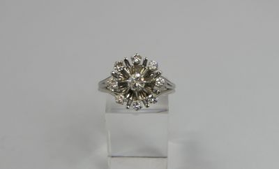a diamond ring with a center stone surrounded by diamonds