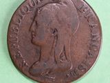 an old coin with a woman ' s profile on it