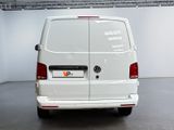 the back end of a white van parked in a garage