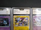 many different types of pokemon cards displayed on the wall