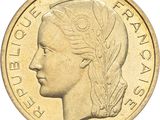 a close up of a coin with a woman ' s face on it