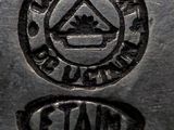 an image of a close up of a metal object with a stamp on it