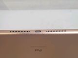 a close up of the back of a gold ipad