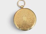 an image of a gold pocket watch with an apple logo on it