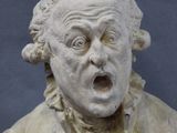 statue of a man with a surprised look on his face