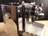 a coffee machine that is sitting on a wooden table