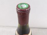 a bottle of wine that is sitting on a table