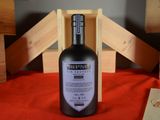 a bottle of wine that is sitting on a table