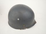 an old helmet with a hole in the middle of it