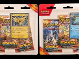 two packs of pokemon trading cards in plastic bags on a black background