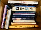 a box full of books that are stacked on top of each other