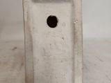 a white vase with a hole in it on a table