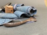 a pair of scissors and a pair of blue jeans on a table